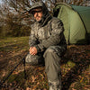 Angler wearing Prologic High Grade Realtree Thermo Fishing Suit outside tent in countryside