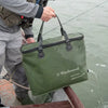 Angler draining water from Wychwood Quick Drain Competitor Bass Bag from boat